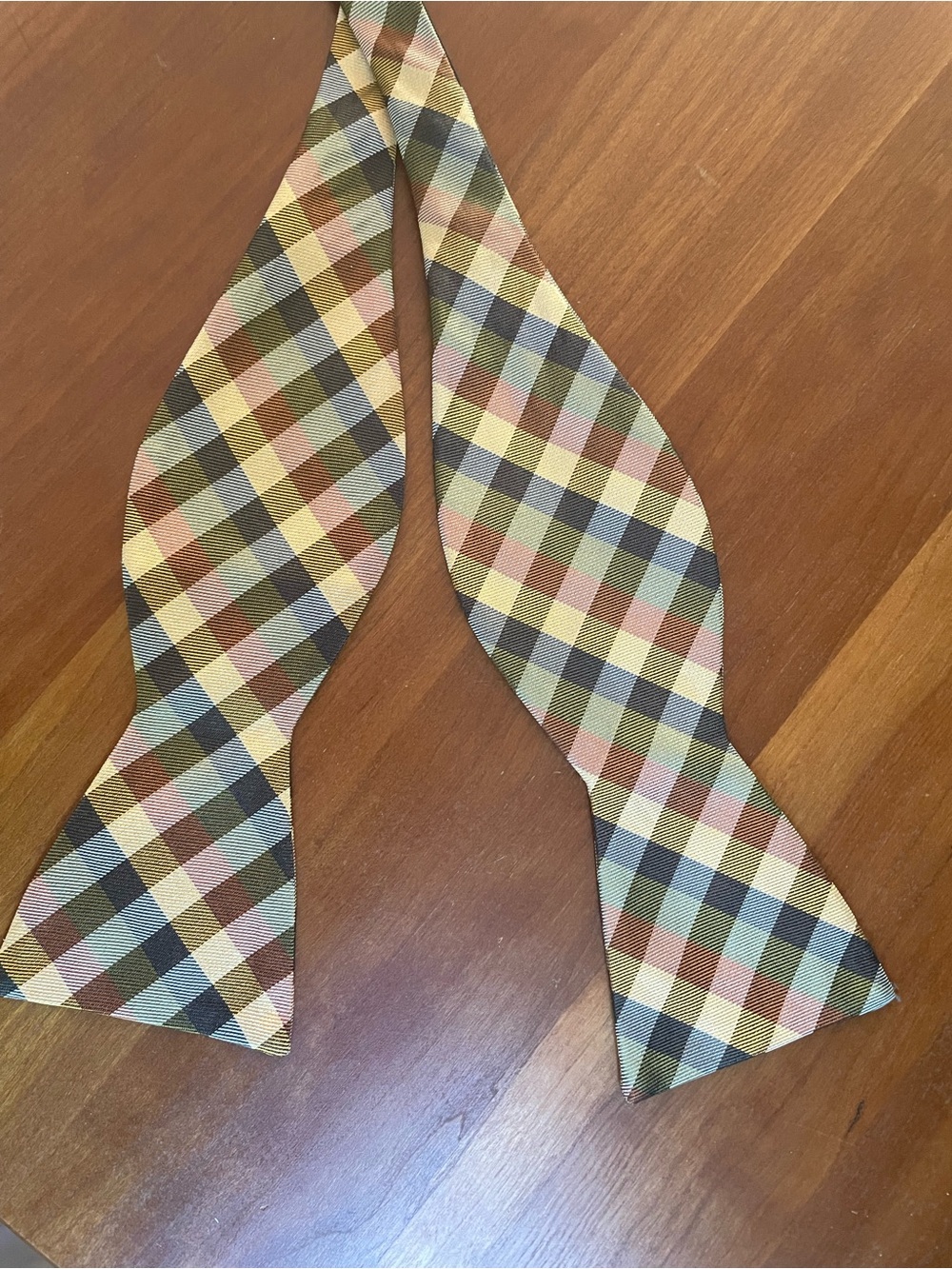 The Tie Bar Plaid Bow Tie Brown, Gold, Copoer and Olive Green.  100% Silk